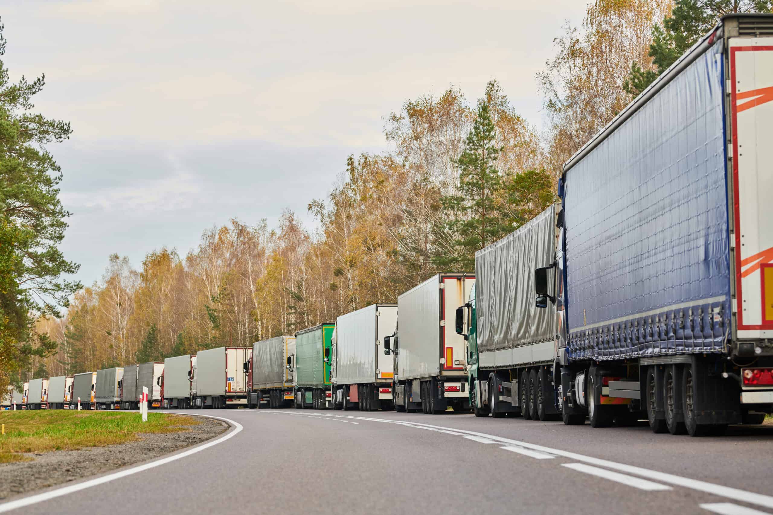 Lorry truck stack in long traffic jam dry vans stuck in a traffic jam due to logistics and border challenges