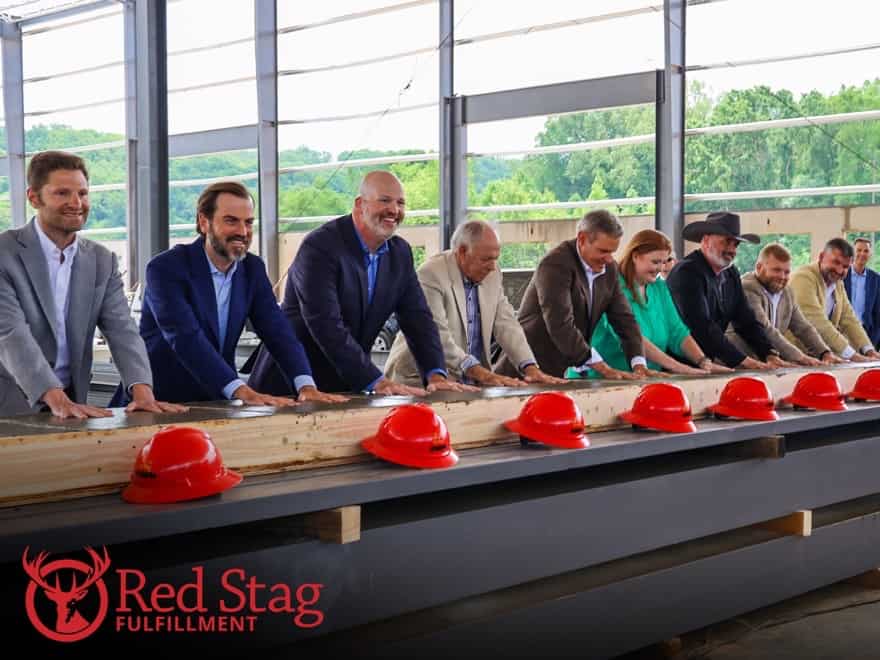 Red Stag's leadership and key stakeholders casting their handprints in the first warehouse's flooring