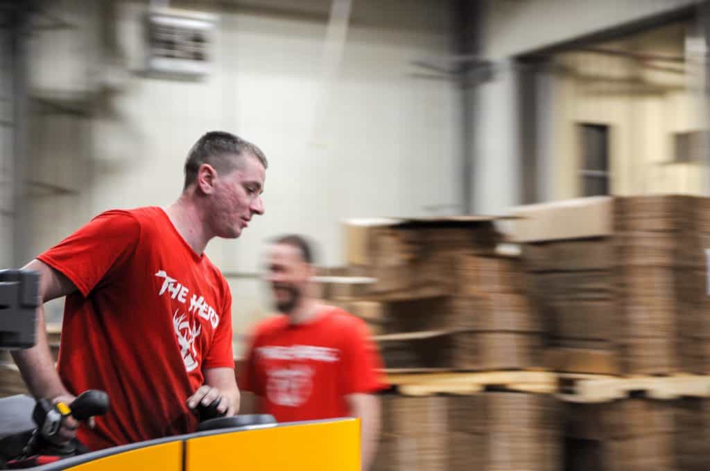 Workers at a Red Stag Fulfillment center