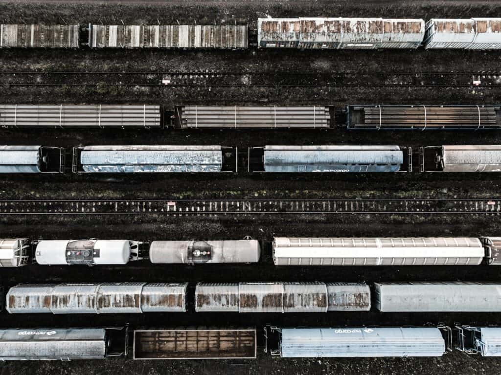 aerial view of a rail yard highlighting different types of goods moving across global supply chains