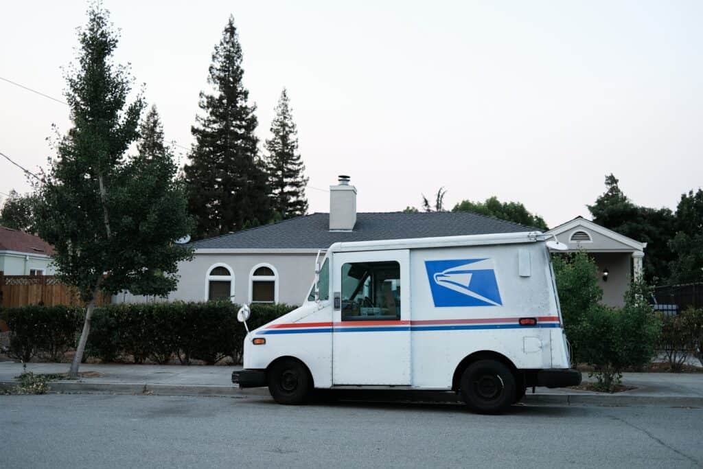 a postal service truck parks outside of your customer's home after you learn how to ship a package USPS