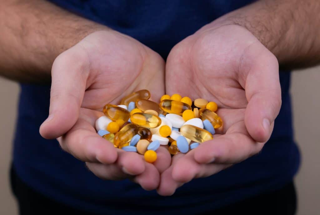 supplement fulfillment with vitamins in a worker's hands